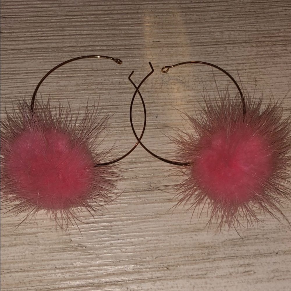 Gold hoops with a pink pom pom!